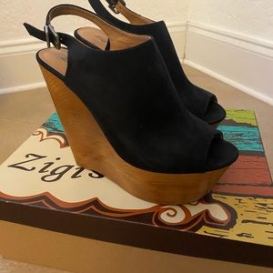Black suede wedge sandal.